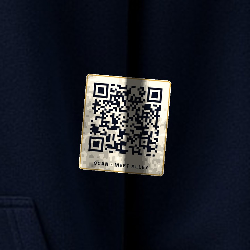 Close-up of the small Saturday QR code printed on the hoodie. It opens saturdayforthewin.com/scan.html.