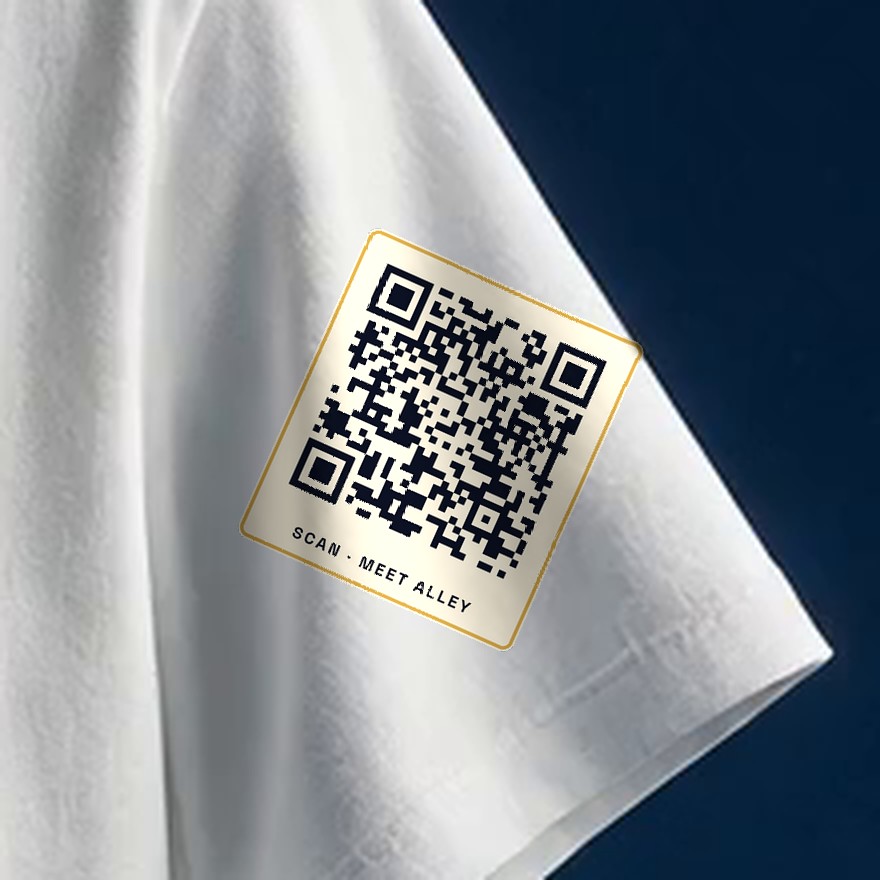 Close-up of the small Saturday QR code printed on a tee sleeve