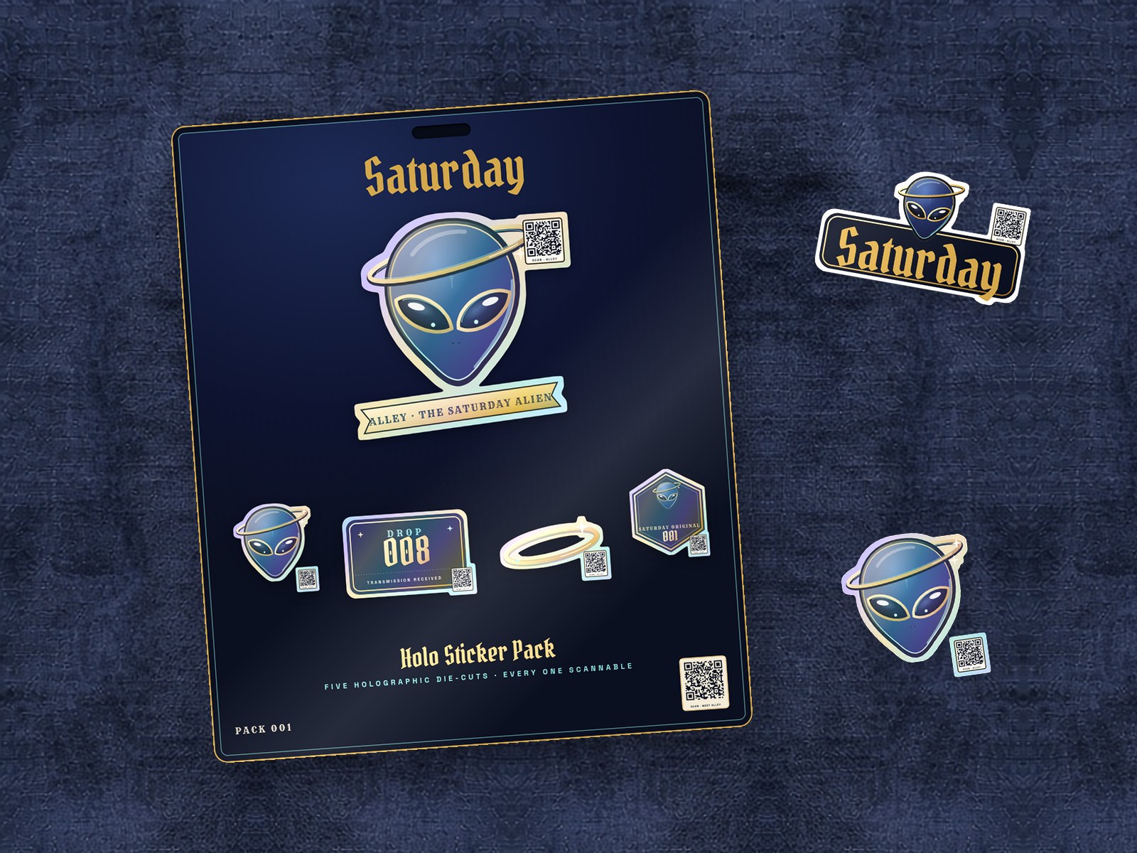 The Saturday Holo Sticker Pack on navy linen: five holographic die-cut stickers of Alley, the gold ring, Drop 008 and Saturday Original 001 on a navy backing card with a small QR code.